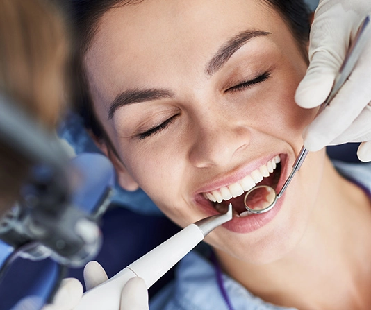 Patient being checked by dentist