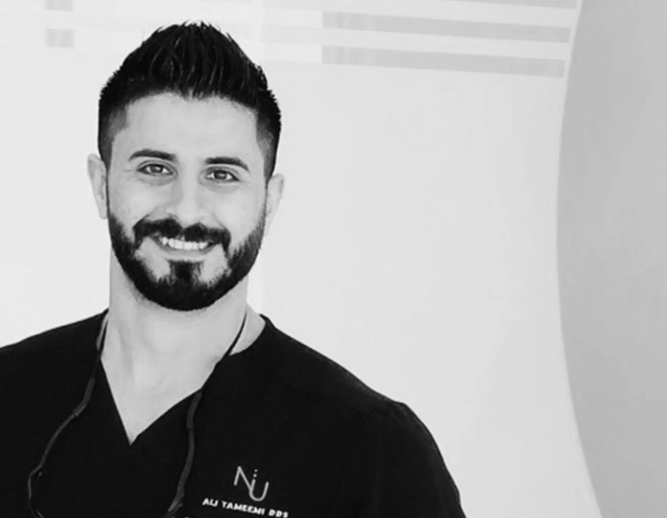 A black and white picture of Dr. Ali Tameemi.