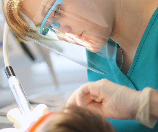 Woman using dental floss