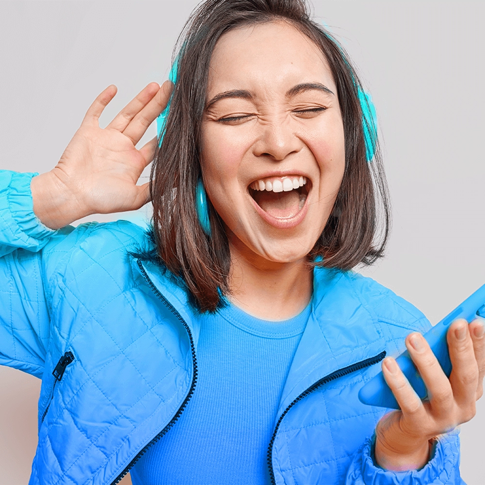 Lady happily listening to music