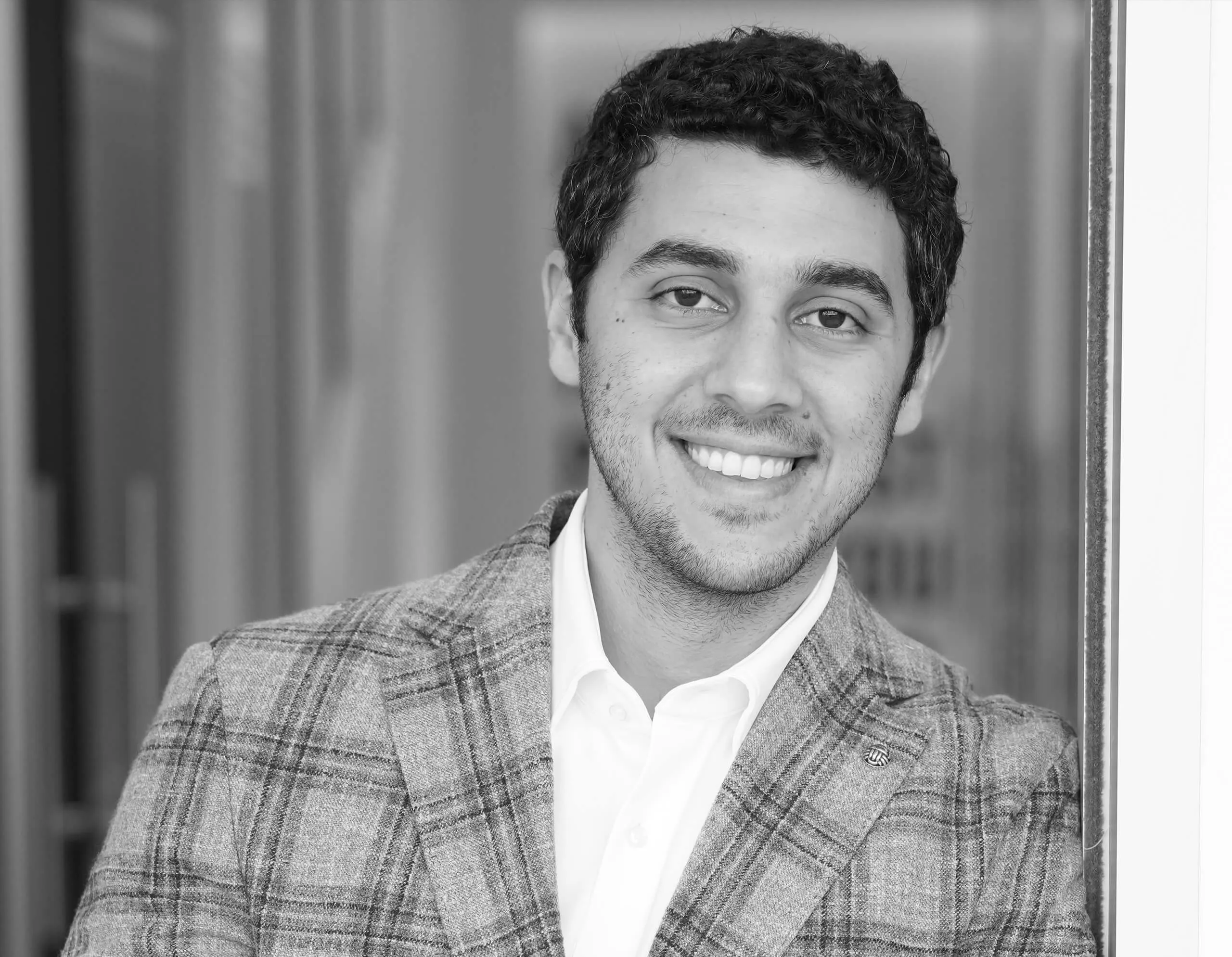 A black and white picture of Dr. Ehab Helow.