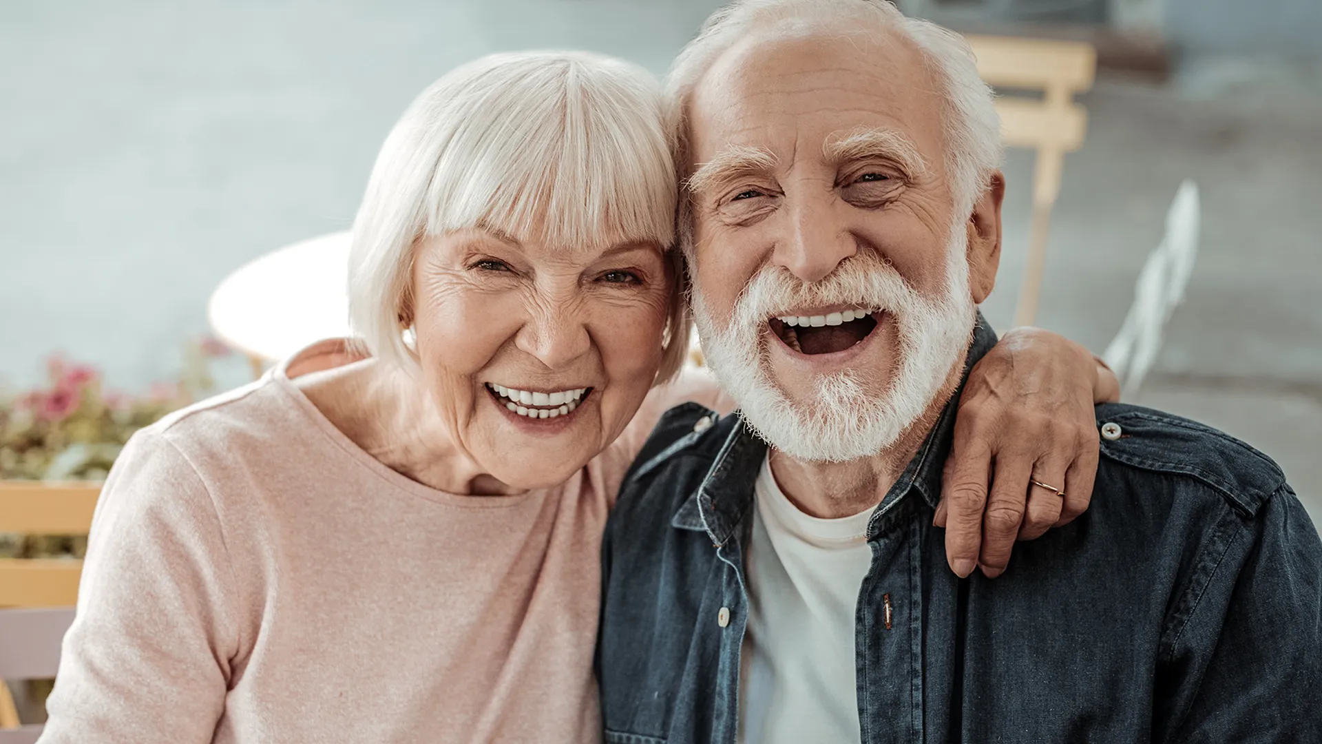 An image of a elderly couple laughing 
