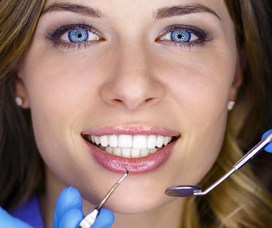 Dental patient smiling with beautiful white teeth