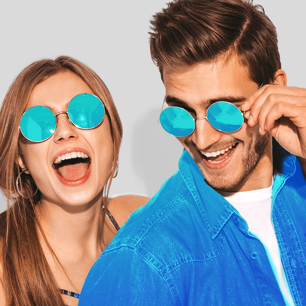 A man and a woman posing happily for the camera